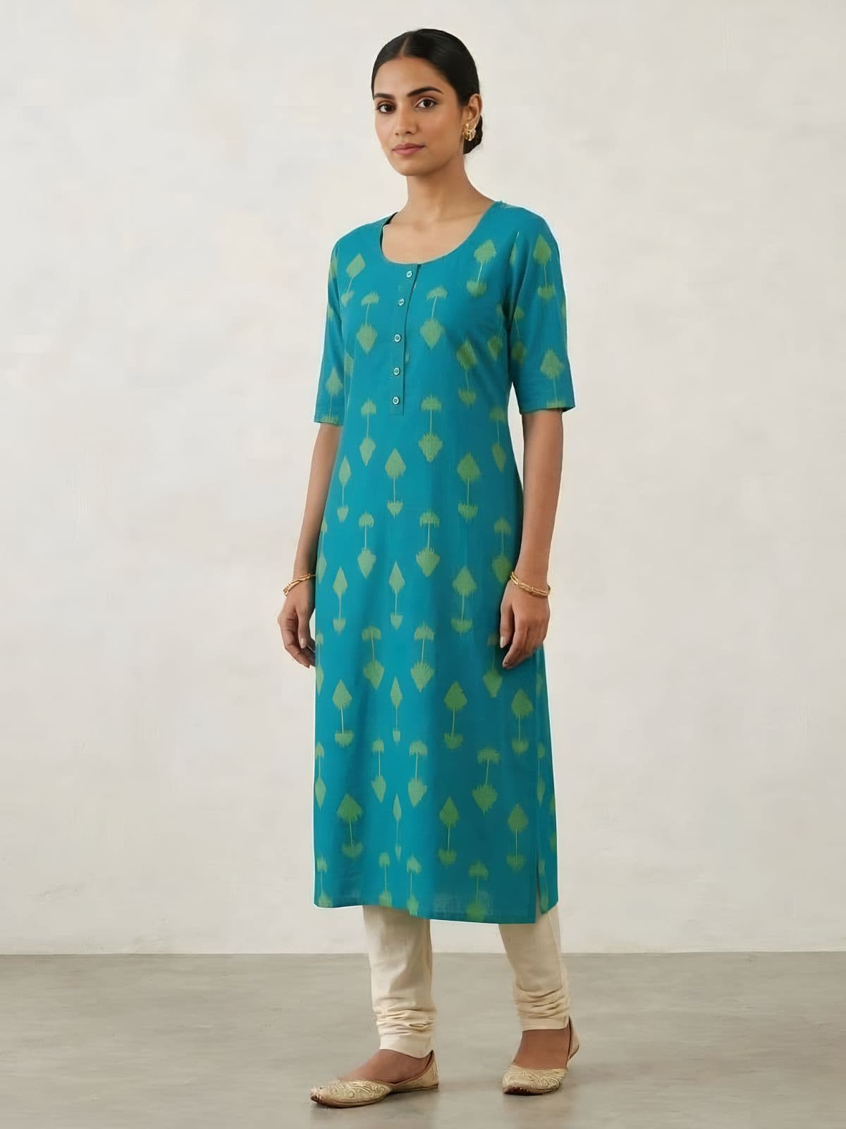 Elegant Turquoise Cotton Kurti with Green Ikat Print and Button Detail - View 1